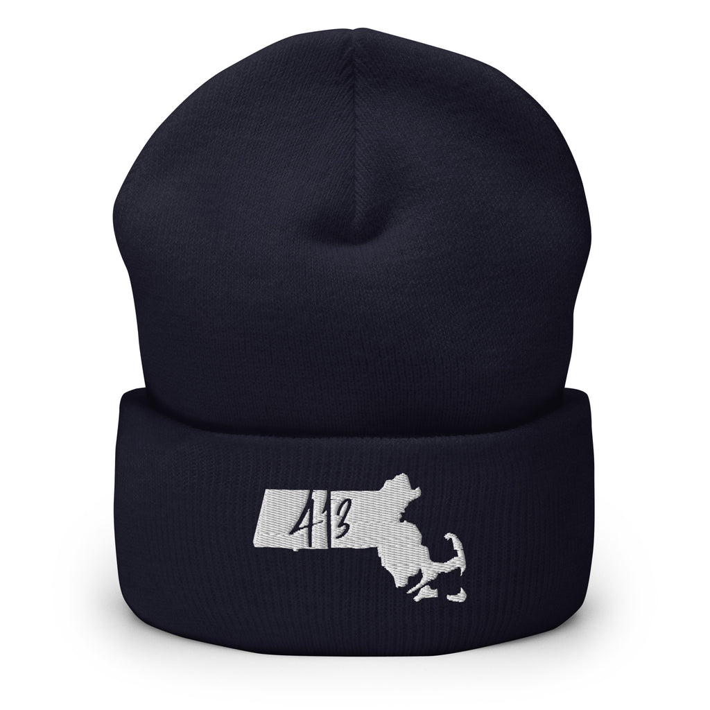 A dark navy blue knit beanie with a folded cuff, featuring a white embroidered graphic of the state of Massachusetts with the number 413 inside.